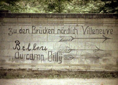 German and English inscriptions on a wall, Soissons, Aisne, France by Fernand Cuville